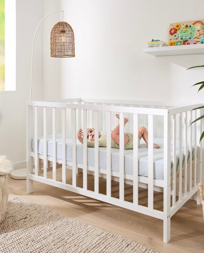 White wooden cot