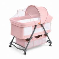 Pink Baby Bassinet Bedside Sleeper with Mosquito Net, Portable Folding Crib, Breathable Mesh Sides, Storage Basket & Lockable Wheels for Newborns and Infants