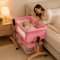 Premium Pink Baby Bassinet Bedside Sleeper with Mosquito Net, Adjustable Height & Wooden Frame