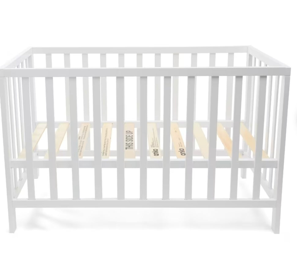White wooden cot
